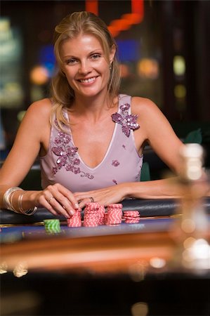 Woman gambling at roulette table in casino Stock Photo - Budget Royalty-Free & Subscription, Code: 400-04035716