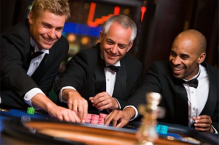 Group of male friends at roulette table in casino Stock Photo - Budget Royalty-Free & Subscription, Code: 400-04035726