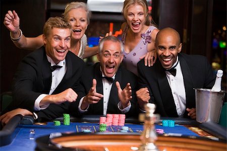 Group of friends celebrating at roulette table in casino Stock Photo - Budget Royalty-Free & Subscription, Code: 400-04035729