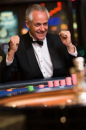 Man celebrating win at roulette table in casino Stock Photo - Budget Royalty-Free & Subscription, Code: 400-04035720