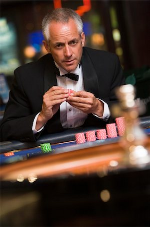 Man gambling at roulette table in casino Stock Photo - Budget Royalty-Free & Subscription, Code: 400-04035721