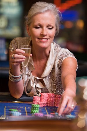 Woman gambling at roulette table in casino Stock Photo - Budget Royalty-Free & Subscription, Code: 400-04035734