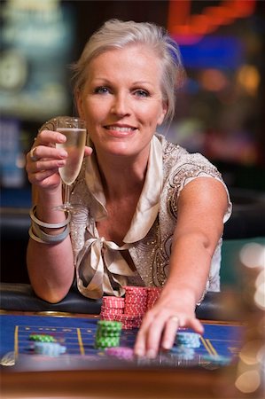 Woman gambling at roulette table in casino Stock Photo - Budget Royalty-Free & Subscription, Code: 400-04035735