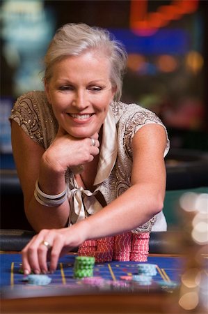 Woman gambling at roulette table in casino Stock Photo - Budget Royalty-Free & Subscription, Code: 400-04035736