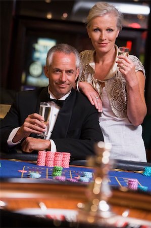 Couple gambling at roulette table in casino Stock Photo - Budget Royalty-Free & Subscription, Code: 400-04035738