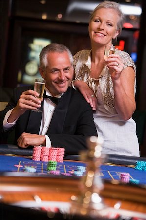 Couple gambling at roulette table in casino Stock Photo - Budget Royalty-Free & Subscription, Code: 400-04035739