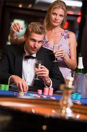 Couple gambling at roulette table in casino Stock Photo - Budget Royalty-Free & Subscription, Code: 400-04035745