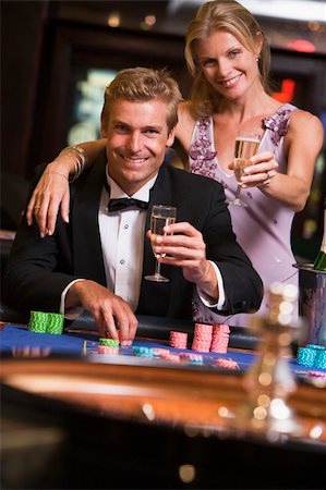 Couple gambling at roulette table in casino Stock Photo - Budget Royalty-Free & Subscription, Code: 400-04035746