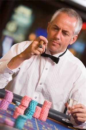 Man gambling at roulette table in casino Stock Photo - Budget Royalty-Free & Subscription, Code: 400-04035762