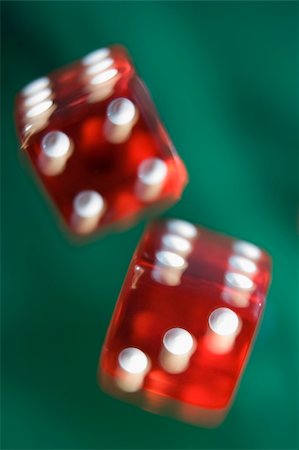 symbols dice - Pair of red dice being thrown against green baize Photographie de stock - Aubaine LD & Abonnement, Code: 400-04035785