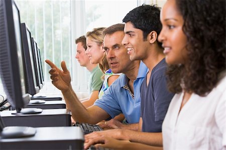 pakistani student - Teacher assisting college student in a computer lab Stock Photo - Budget Royalty-Free & Subscription, Code: 400-04035846