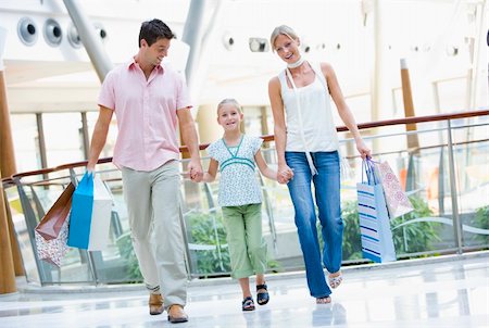 Family shopping in mall carrying bags Stock Photo - Budget Royalty-Free & Subscription, Code: 400-04036036