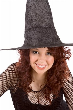 simsearch:400-04007612,k - Portrait of busty Latina teenager girl in black Halloween hat and fishnet dress Stock Photo - Budget Royalty-Free & Subscription, Code: 400-04036127