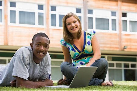 student college laptop lying grass - Two college students using laptop on campus lawn, Stock Photo - Budget Royalty-Free & Subscription, Code: 400-04036243