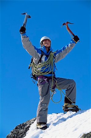 simsearch:400-04037283,k - Young man celebrating on snowy peak Stock Photo - Budget Royalty-Free & Subscription, Code: 400-04036382