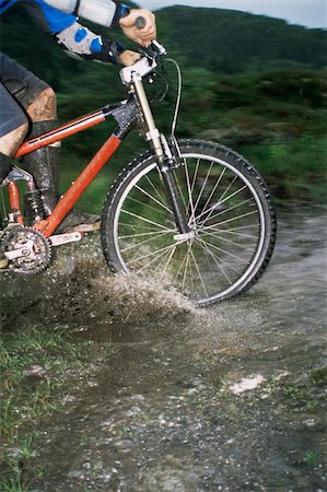 Mountain biker crossing stream Stock Photo - Budget Royalty-Free & Subscription, Code: 400-04036397