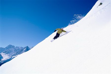 snowboarder powder snow - Young woman snowboarding Stock Photo - Budget Royalty-Free & Subscription, Code: 400-04036415