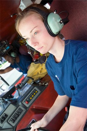 A firefighter driving a fire engine Stock Photo - Budget Royalty-Free & Subscription, Code: 400-04036433