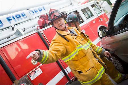 simsearch:640-01358080,k - Firefighters cutting open a car to help an injured person Stock Photo - Budget Royalty-Free & Subscription, Code: 400-04036458