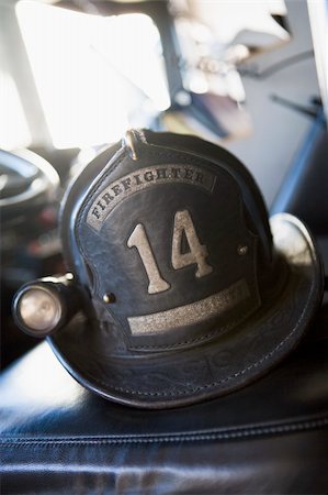fire truck close - Vintage firefighter's helmet Stock Photo - Budget Royalty-Free & Subscription, Code: 400-04036467