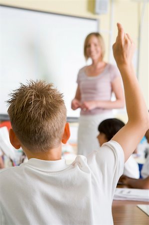 simsearch:400-04536422,k - A teacher teaching a junior school class Foto de stock - Super Valor sin royalties y Suscripción, Código: 400-04036484