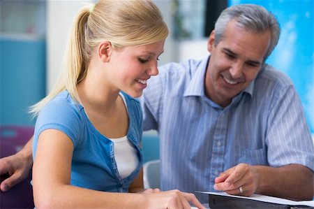 A teacher instructs a schoolgirl in a high school class Stock Photo - Budget Royalty-Free & Subscription, Code: 400-04036651