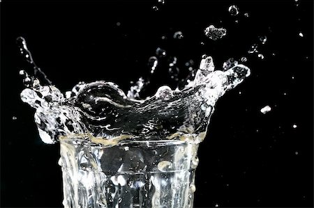 simsearch:614-05955730,k - splash in glass on dark background Stock Photo - Budget Royalty-Free & Subscription, Code: 400-04036727