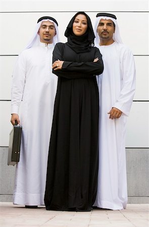 Two Middle Eastern businessmen standing with a woman Stock Photo - Budget Royalty-Free & Subscription, Code: 400-04036991