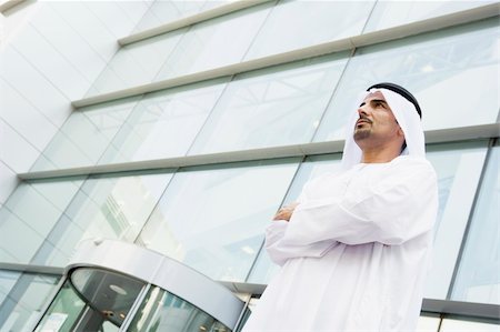 A Middle Eastern businessman standing outside an office block Photographie de stock - Aubaine LD & Abonnement, Code: 400-04036993