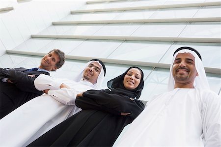 Middle Eastern and Caucasian business workers standing outside a Photographie de stock - Aubaine LD & Abonnement, Code: 400-04037007