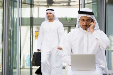 simsearch:400-04037075,k - A Middle Eastern businessman sitting with a laptop Stock Photo - Budget Royalty-Free & Subscription, Code: 400-04037015