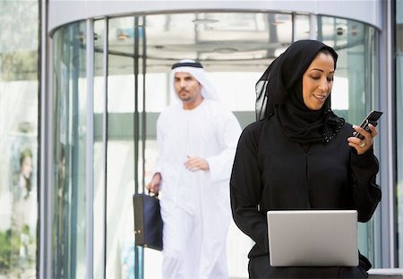 simsearch:400-04037075,k - A Middle Eastern business woman sitting with a laptop Stock Photo - Budget Royalty-Free & Subscription, Code: 400-04037025