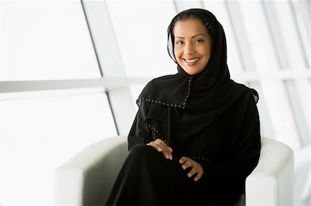 A Middle Eastern businesswoman sitting in a chair Stock Photo - Budget Royalty-Free & Subscription, Code: 400-04037043