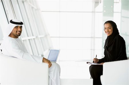 simsearch:400-04037075,k - A Middle Eastern man and woman talking at a business meeting Stock Photo - Budget Royalty-Free & Subscription, Code: 400-04037054