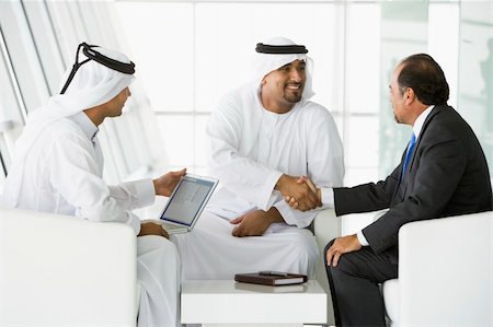 simsearch:400-04037075,k - Three Middle Eastern men talking at a business meeting Stock Photo - Budget Royalty-Free & Subscription, Code: 400-04037065