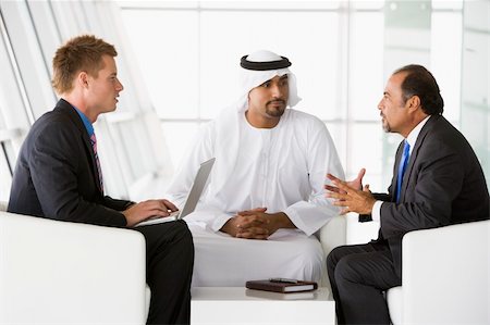 simsearch:400-04037075,k - Two Middle Eastern men and a caucasian man talking at a business Stock Photo - Budget Royalty-Free & Subscription, Code: 400-04037066