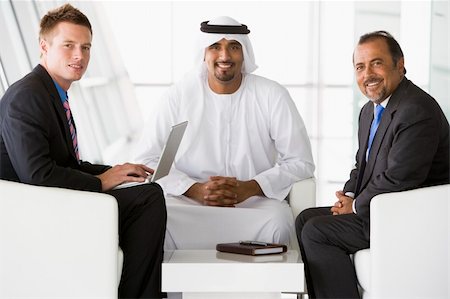 simsearch:400-04037075,k - Two Middle Eastern men and a caucasian man talking at a business Stock Photo - Budget Royalty-Free & Subscription, Code: 400-04037067