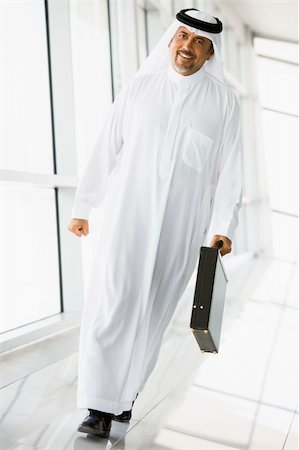 simsearch:400-04037075,k - A Middle Eastern businessman walking in a corridor Stock Photo - Budget Royalty-Free & Subscription, Code: 400-04037075