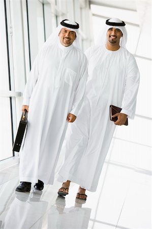 simsearch:400-04037075,k - Two Middle Eastern businessmen walking in a corridor Stock Photo - Budget Royalty-Free & Subscription, Code: 400-04037076