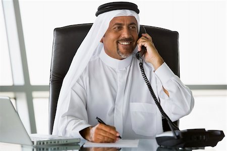 simsearch:400-04037075,k - A Middle Eastern businessman talking on the telephone Stock Photo - Budget Royalty-Free & Subscription, Code: 400-04037087