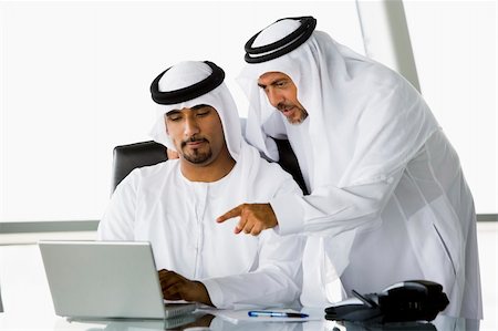 simsearch:400-04037075,k - Two Middle Eastern businessmen beside a laptop Stock Photo - Budget Royalty-Free & Subscription, Code: 400-04037080