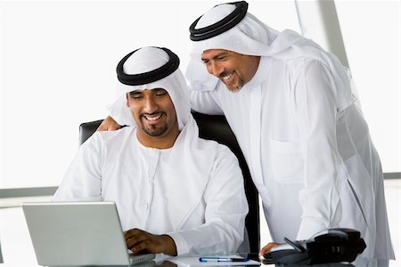 simsearch:400-04037075,k - Two Middle Eastern businessmen beside a laptop Stock Photo - Budget Royalty-Free & Subscription, Code: 400-04037081