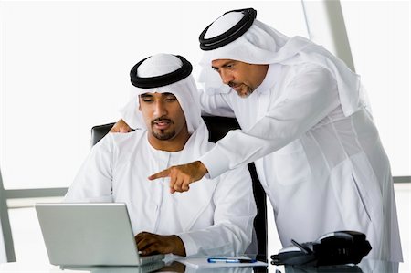 simsearch:400-04037075,k - Two Middle Eastern businessmen looking at a computer Stock Photo - Budget Royalty-Free & Subscription, Code: 400-04037099