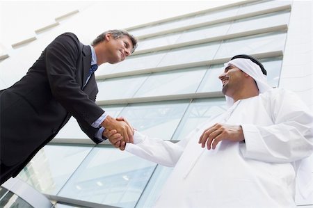 simsearch:400-04037075,k - A Middle Eastern businessman shaking hands with a Caucasian busi Stock Photo - Budget Royalty-Free & Subscription, Code: 400-04037092