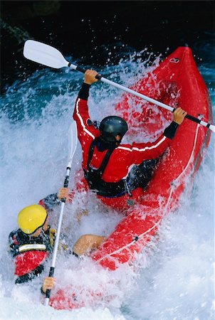 simsearch:841-07202440,k - Two people paddling inflatable boat down rapids Photographie de stock - Aubaine LD & Abonnement, Code: 400-04037284