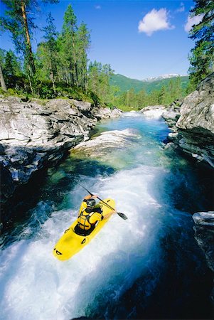 Young man kayaking in river Stock Photo - Budget Royalty-Free & Subscription, Code: 400-04037290