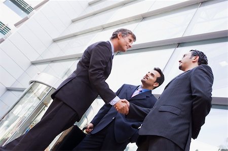 Group of businessmen shaking hands outside modern office Stock Photo - Budget Royalty-Free & Subscription, Code: 400-04037314