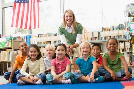 pictures of filipino male teacher - Kindergarten teacher sitting with children in library Foto de stock - Super Valor sin royalties y Suscripción, Código: 400-04037826