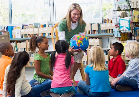pictures of filipino male teacher - Kindergarten teacher and children looking at globe in library Stock Photo - Budget Royalty-Free & Subscription, Code: 400-04037821