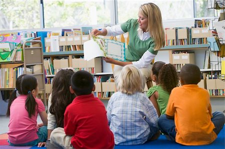 pictures of filipino male teacher - Kindergarten teacher reading to children in library Foto de stock - Super Valor sin royalties y Suscripción, Código: 400-04037867